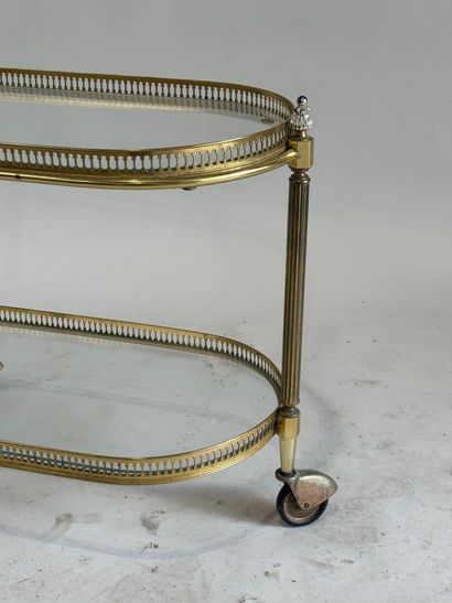 Small gilded metal and glass-topped rolling...