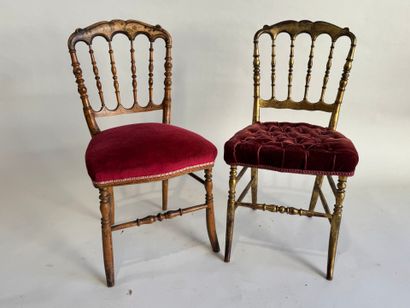 Two charivari chairs in molded and gilded...