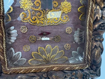 Small reliquary frame in gilded and carved...