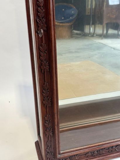 Moulded, carved and stained oak display case...