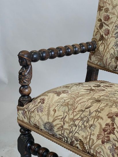Armchair in stained natural wood, the armrests,...