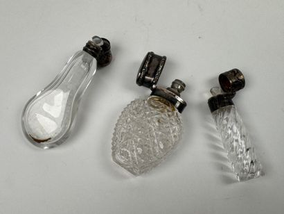 Three crystal and cut-glass salt flasks,...