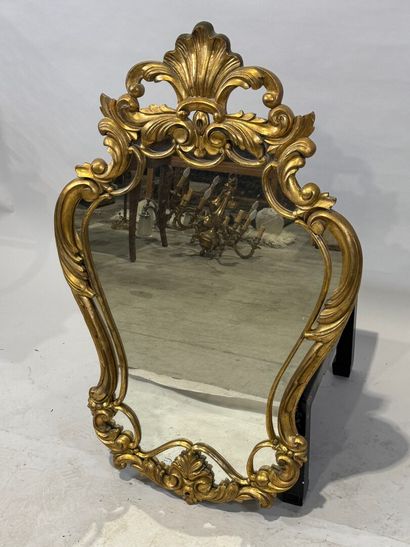 Gilded wood glazed mirror with a violin shape,...