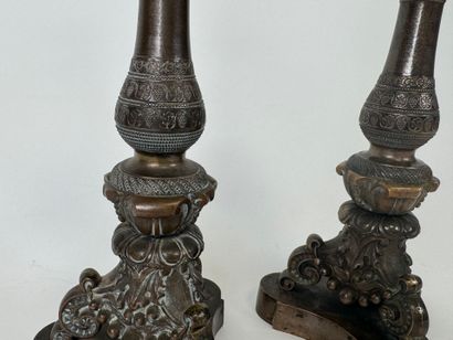 Pair of tripod candlesticks in patinated...