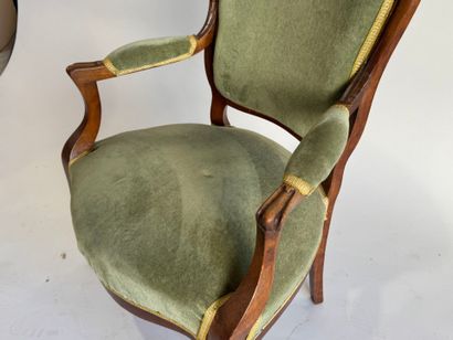 Moulded mahogany armchair with green velvet...