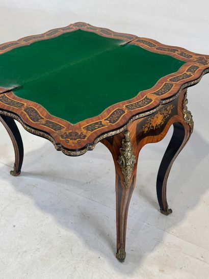 Wood and marquetry game table featuring a...