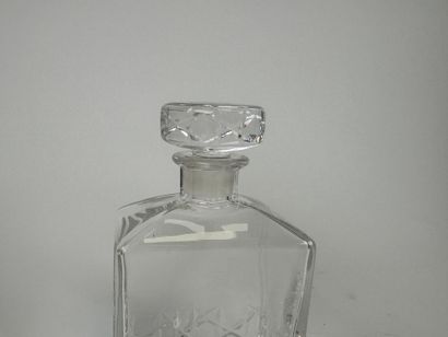 Cut crystal decanter. H. 20.5 cm. An identical...