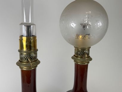 Pair of glazed ceramic kerosene lamps on...