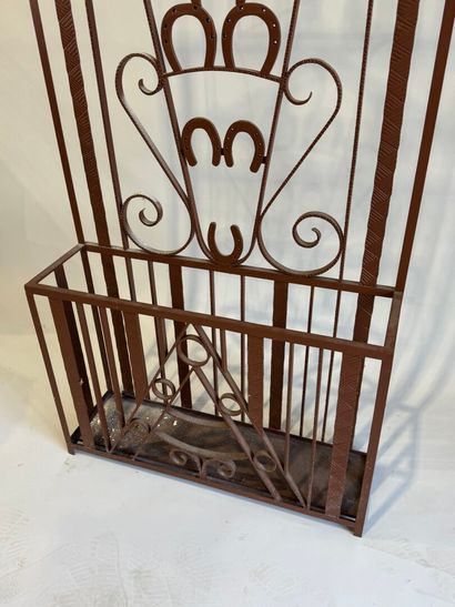 Wrought and painted iron checkroom decorated...