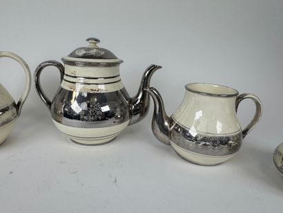 LANGEAIS.
Four cream and silvered earthenware...
