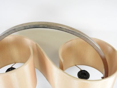 Circular chrome-plated metal lamp on a rectangular...