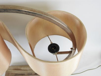 Circular chrome-plated metal lamp on a rectangular...