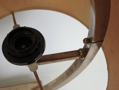 Circular chrome-plated metal lamp on a rectangular...