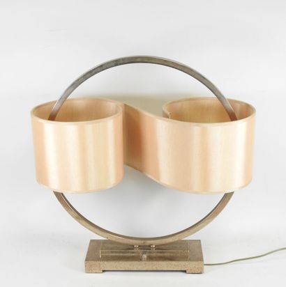Circular chrome-plated metal lamp on a rectangular...