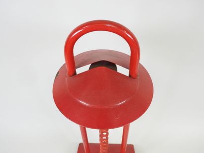 Red lacquered metal desk lamp.
Work from...