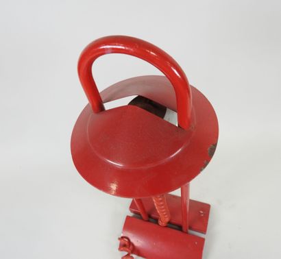 Red lacquered metal desk lamp.
Work from...