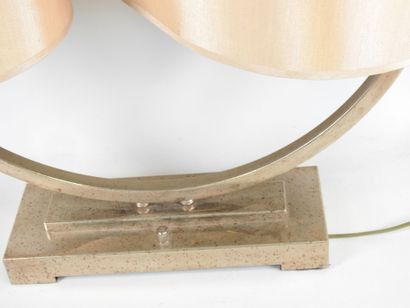 Circular chrome-plated metal lamp on a rectangular...