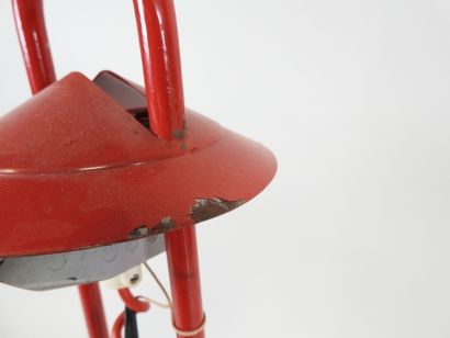 Red lacquered metal desk lamp.
Work from...