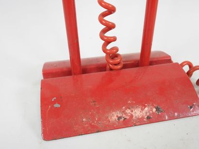 Red lacquered metal desk lamp.
Work from...