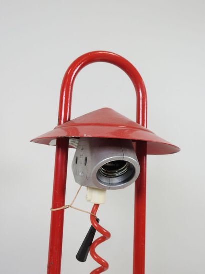 Red lacquered metal desk lamp.
Work from...