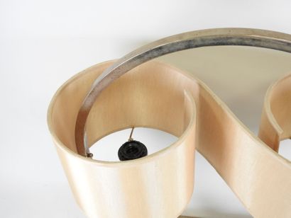 Circular chrome-plated metal lamp on a rectangular...