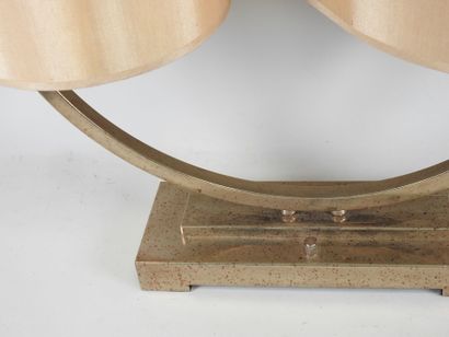 Circular chrome-plated metal lamp on a rectangular...