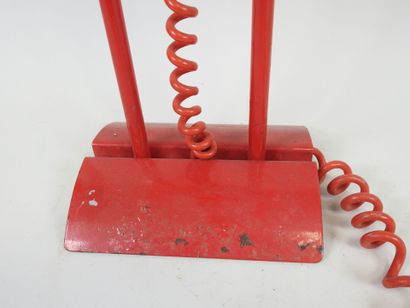 Red lacquered metal desk lamp.
Work from...