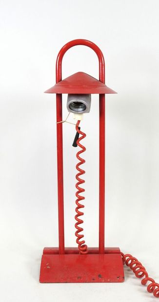 Red lacquered metal desk lamp.
Work from...