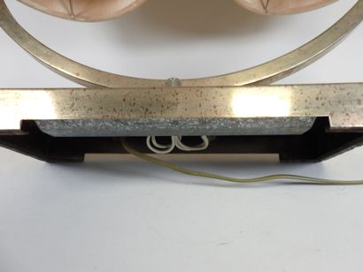 Circular chrome-plated metal lamp on a rectangular...