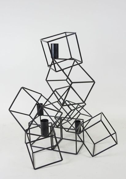 Black lacquered metal candelabra in the form...