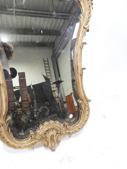Wood and gilded stucco mirror with Rocaille...