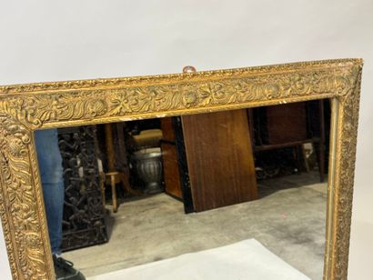 Rectangular wood and gilded stucco mirror...
