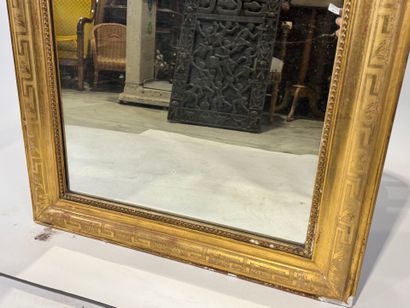 Wood and gilded stucco mirror with rounded...
