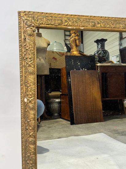 Rectangular wood and gilded stucco mirror...
