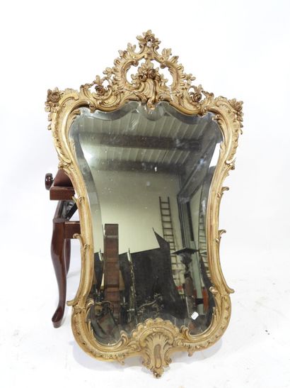 Wood and gilded stucco mirror with Rocaille...