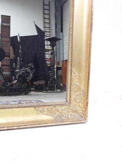Rectangular wood and gilded stucco mirror...
