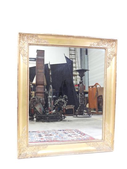 Rectangular wood and gilded stucco mirror...
