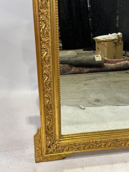 Rectangular wood and stucco mirror with rows...