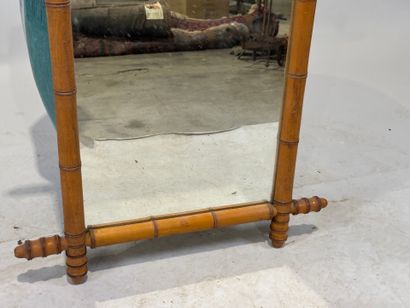 Rectangular bamboo-framed mirror. 
69 x 56...