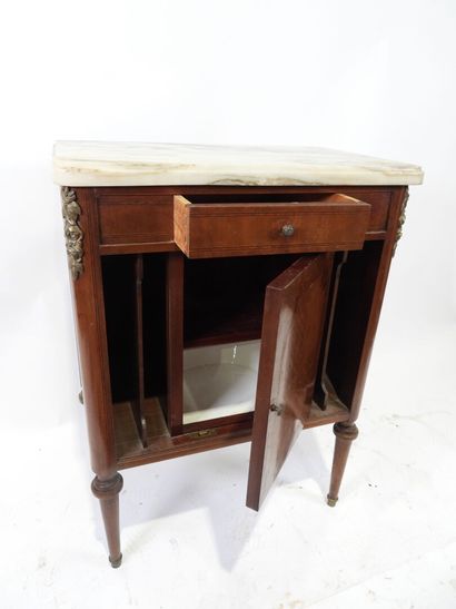 Wooden and veneered bedside cabinet opening...