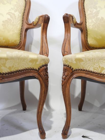 Suite of four molded and carved wood armchairs,...