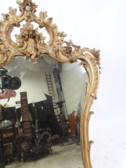 Wood and gilded stucco mirror with Rocaille...