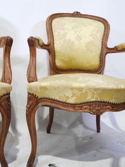 Suite of four molded and carved wood armchairs,...