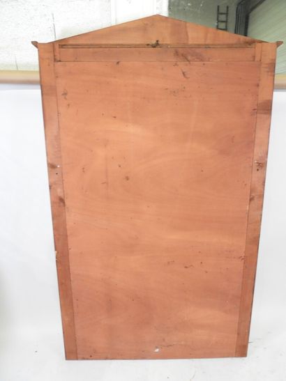 Exotic wood mirror with half-columns topped...