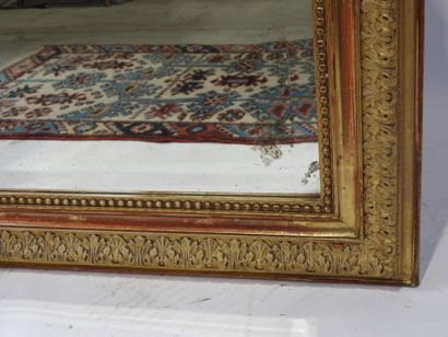 Rectangular wood and gilded stucco mirror...