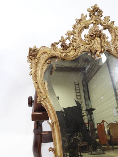 Wood and gilded stucco mirror with Rocaille...