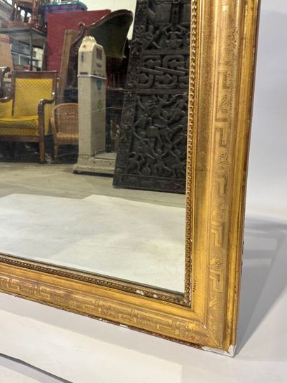 Wood and gilded stucco mirror with rounded...