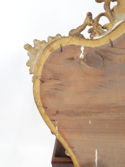 Wood and gilded stucco mirror with Rocaille...