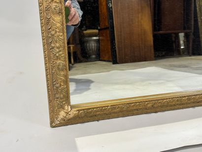 Rectangular wood and gilded stucco mirror...