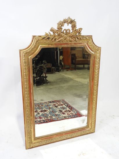 Rectangular wood and gilded stucco mirror...